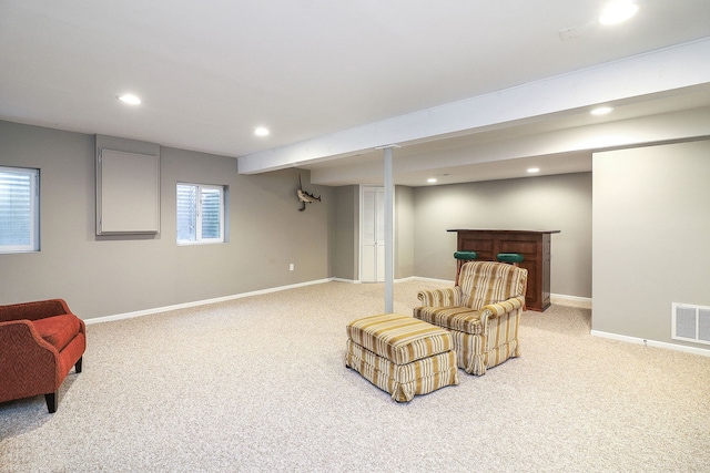 living area featuring carpet, visible vents, baseboards, and recessed lighting