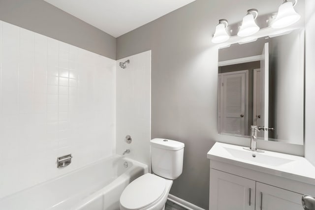 bathroom with toilet, washtub / shower combination, and vanity