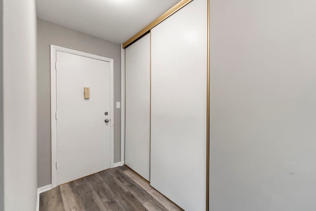 entryway with wood finished floors