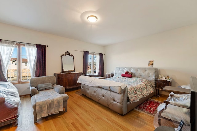 bedroom with light wood finished floors