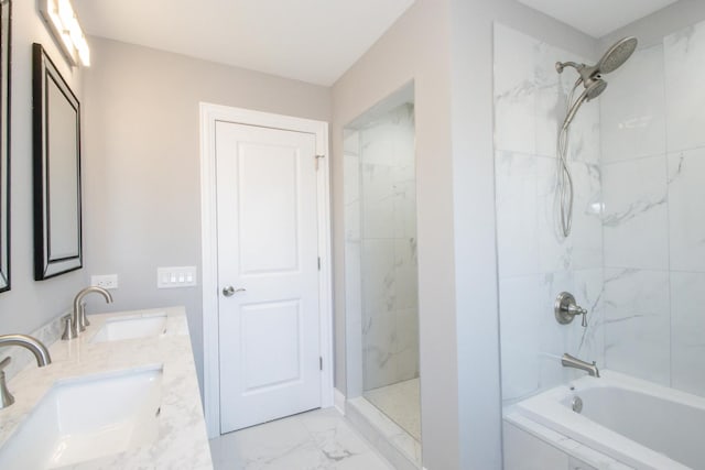 bathroom with a combined bath / shower with marble appearance, marble finish floor, a sink, and double vanity