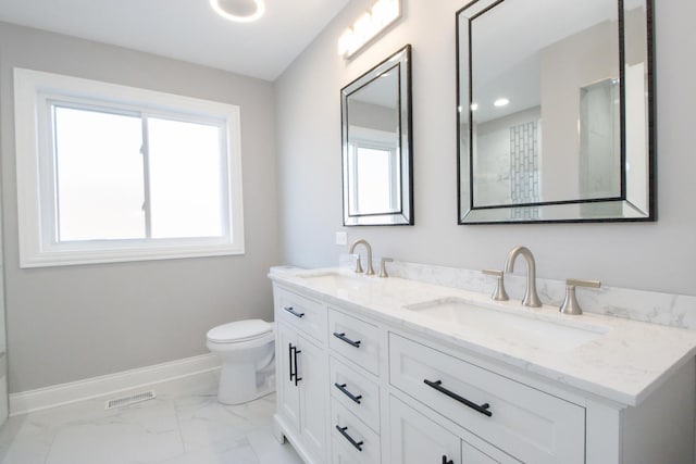 full bath with marble finish floor, a sink, baseboards, and toilet