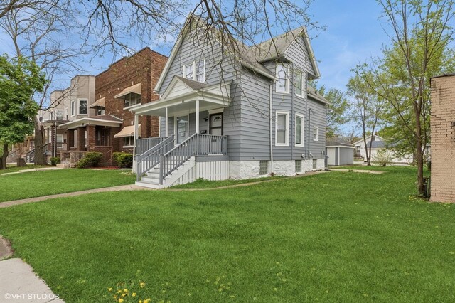view of front of home featuring a front yard and a porch