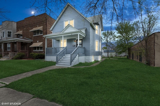 view of front of property with a porch and a front yard
