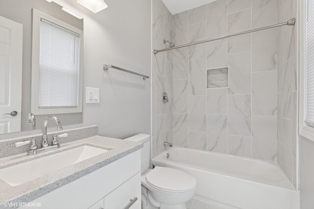 bathroom with vanity, toilet, and shower / bathtub combination
