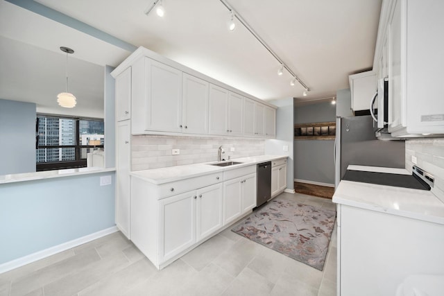 kitchen with a sink, white cabinets, light countertops, appliances with stainless steel finishes, and hanging light fixtures