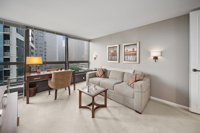 living room with light colored carpet, a city view, and baseboards