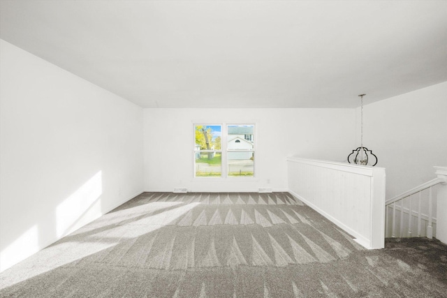 unfurnished room featuring carpet flooring