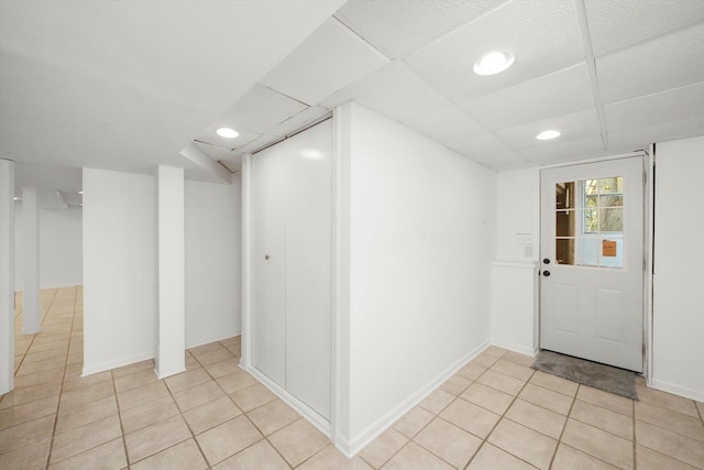 entryway featuring recessed lighting, light tile patterned flooring, and baseboards