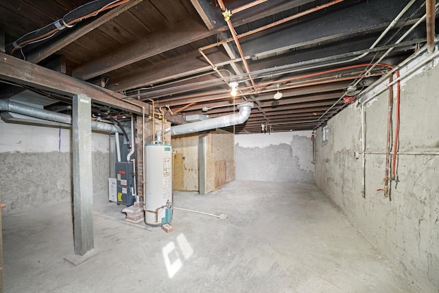 unfinished basement with gas water heater and heating unit