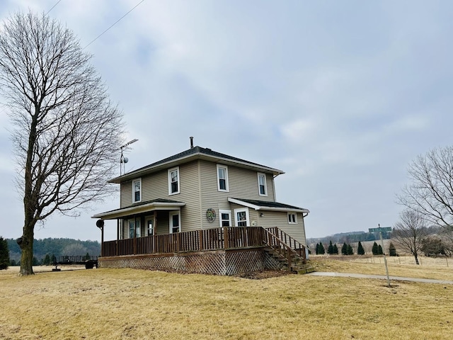 back of house featuring a yard