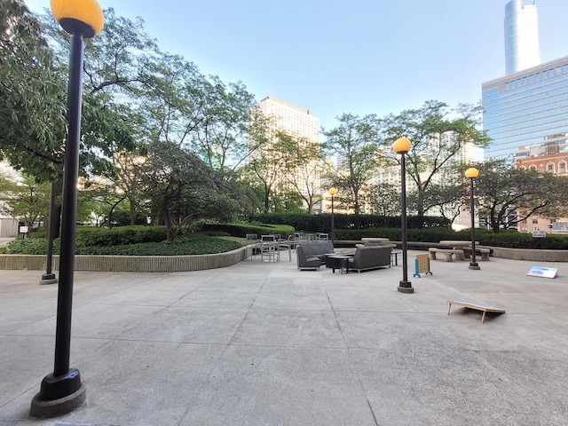 view of home's community with a patio and an outdoor living space