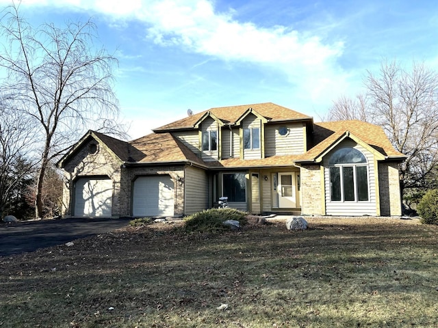 view of front of property featuring driveway and an attached garage