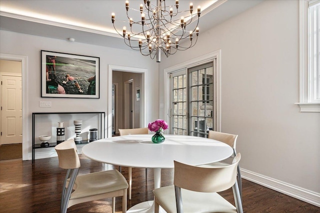 dining area featuring baseboards and dark wood-type flooring