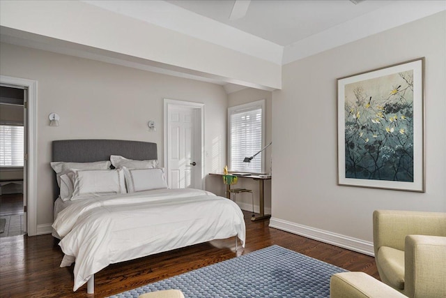 bedroom featuring wood finished floors and baseboards