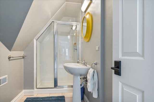 full bath featuring tile patterned flooring, visible vents, a stall shower, and baseboards