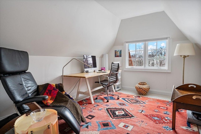 office featuring baseboards, lofted ceiling, and carpet