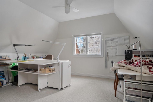 office with light carpet, a ceiling fan, baseboards, and vaulted ceiling