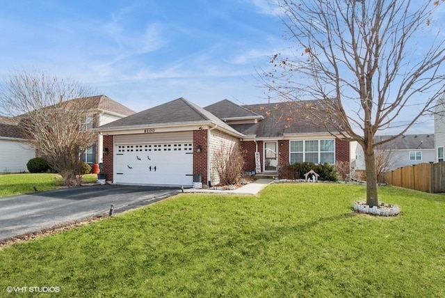 single story home with brick siding, fence, a garage, driveway, and a front lawn