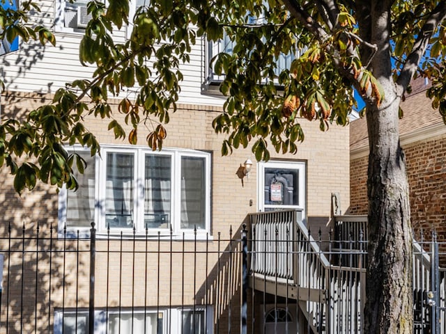 view of exterior entry with brick siding