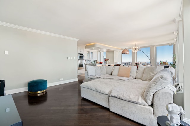 living room featuring a notable chandelier, crown molding, baseboards, and dark wood-type flooring