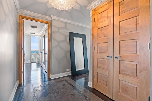 hallway featuring baseboards and ornamental molding