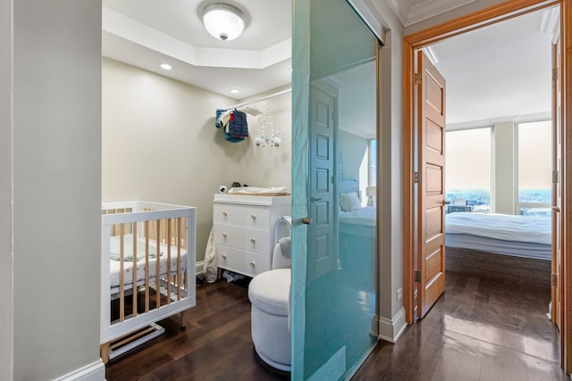 bathroom with ensuite bathroom, wood-type flooring, baseboards, and recessed lighting