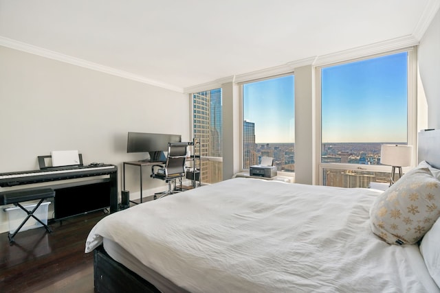 bedroom with ornamental molding, expansive windows, multiple windows, and wood finished floors