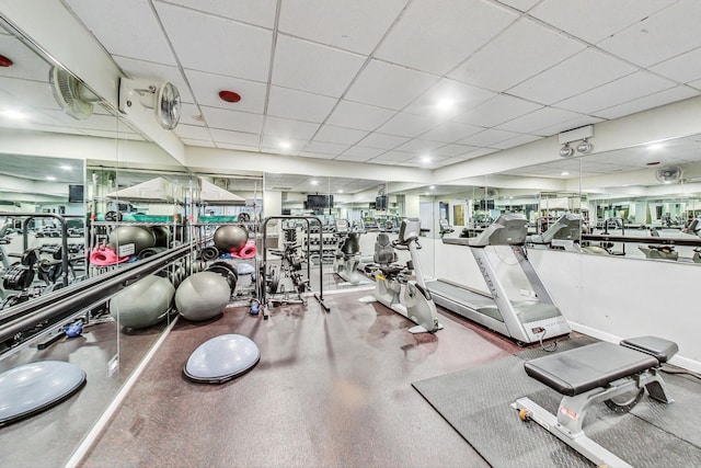 gym featuring a paneled ceiling