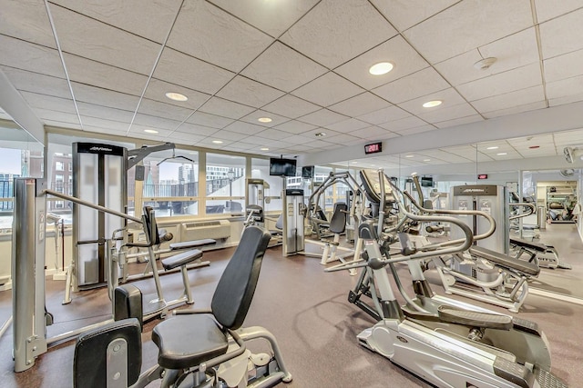 workout area featuring a paneled ceiling and recessed lighting