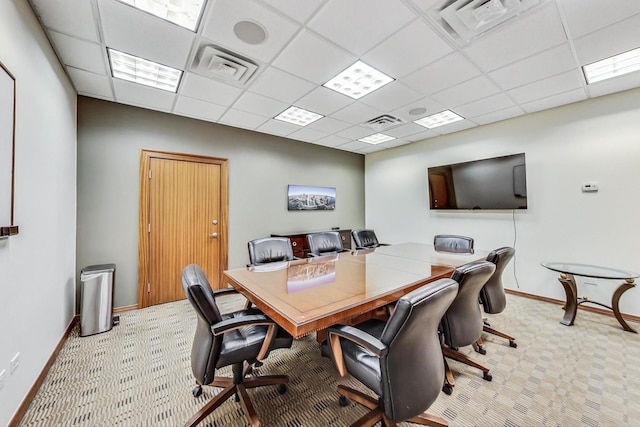 office area with light colored carpet, visible vents, and baseboards