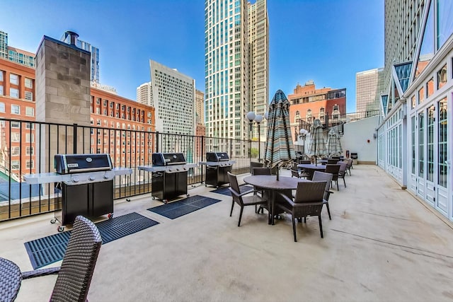 view of patio / terrace with a grill and a city view