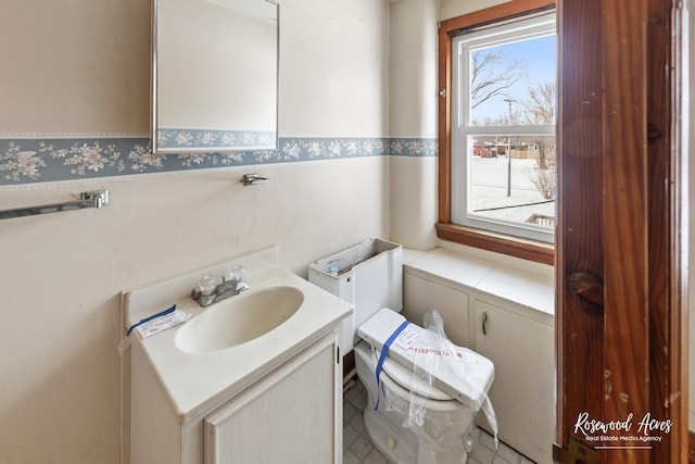 half bath with vanity and toilet