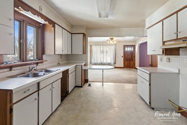 kitchen featuring light countertops and white cabinets