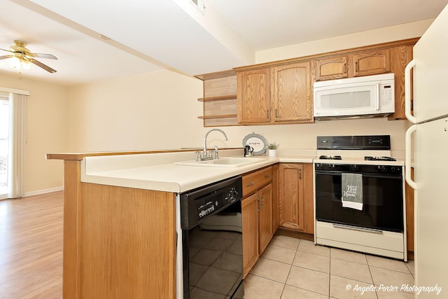 kitchen featuring light countertops, white appliances, open shelves, and a sink