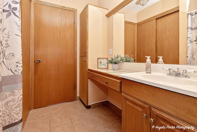 full bath featuring vanity and tile patterned floors