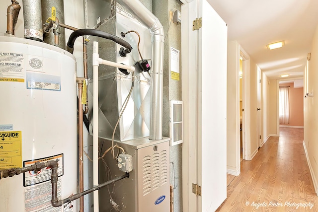 utility room featuring water heater