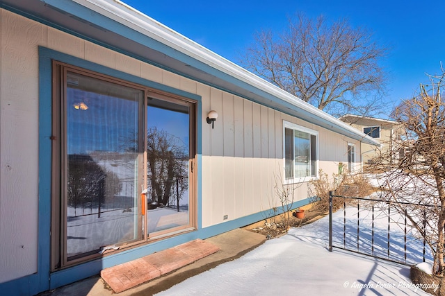 view of snowy exterior featuring a patio area