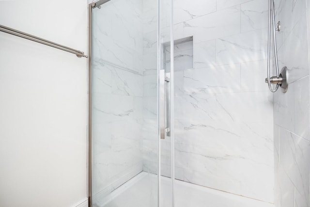 full bath with a shower with shower door