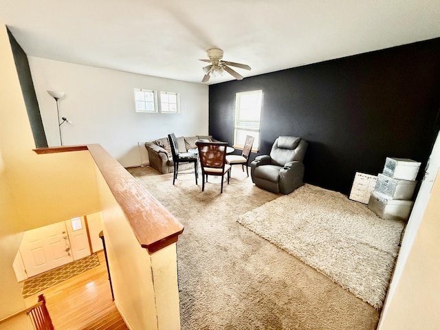 interior space with ceiling fan