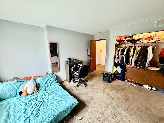 bedroom featuring a closet, carpet flooring, and visible vents