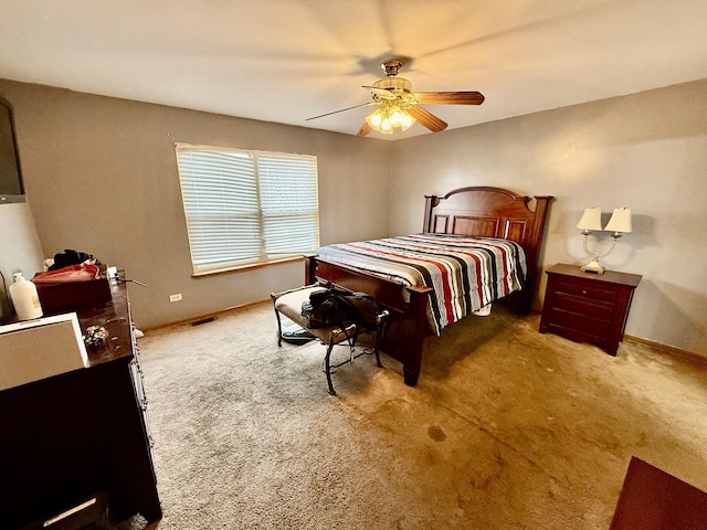 bedroom with carpet floors, a ceiling fan, and baseboards