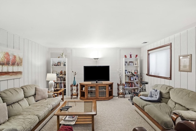 living area with carpet and visible vents