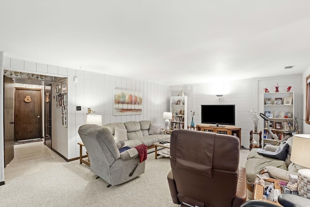 living room featuring visible vents and light colored carpet