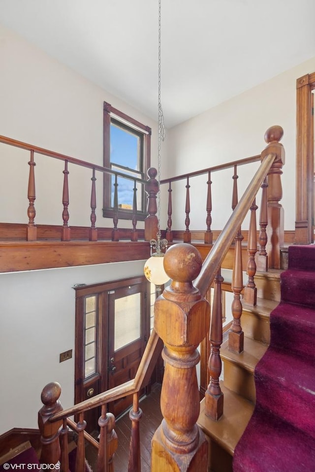 stairway featuring wood finished floors