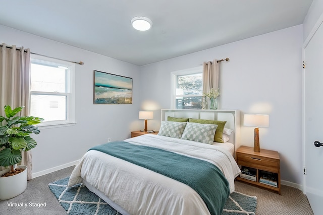 bedroom with carpet flooring and baseboards