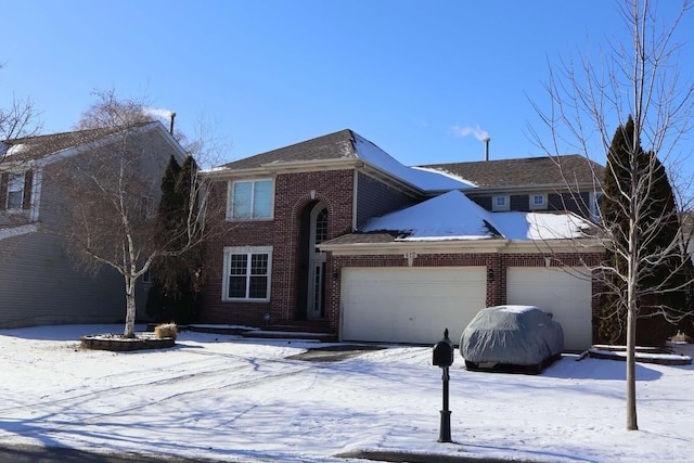 traditional-style house featuring brick siding and an attached garage