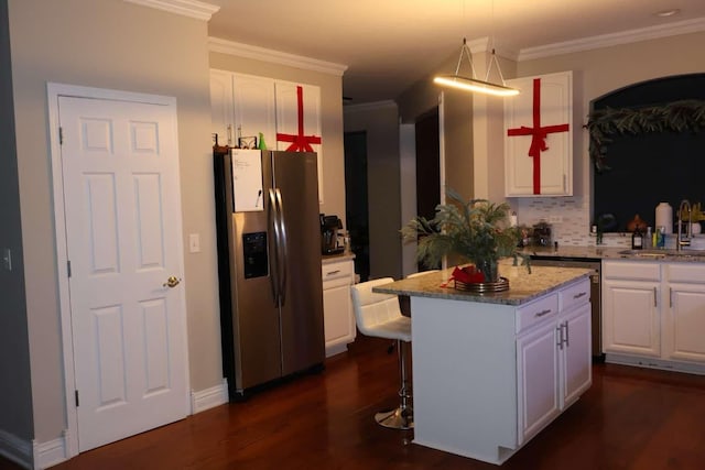 kitchen featuring white cabinets, stainless steel fridge with ice dispenser, dark wood-type flooring, a center island, and a sink