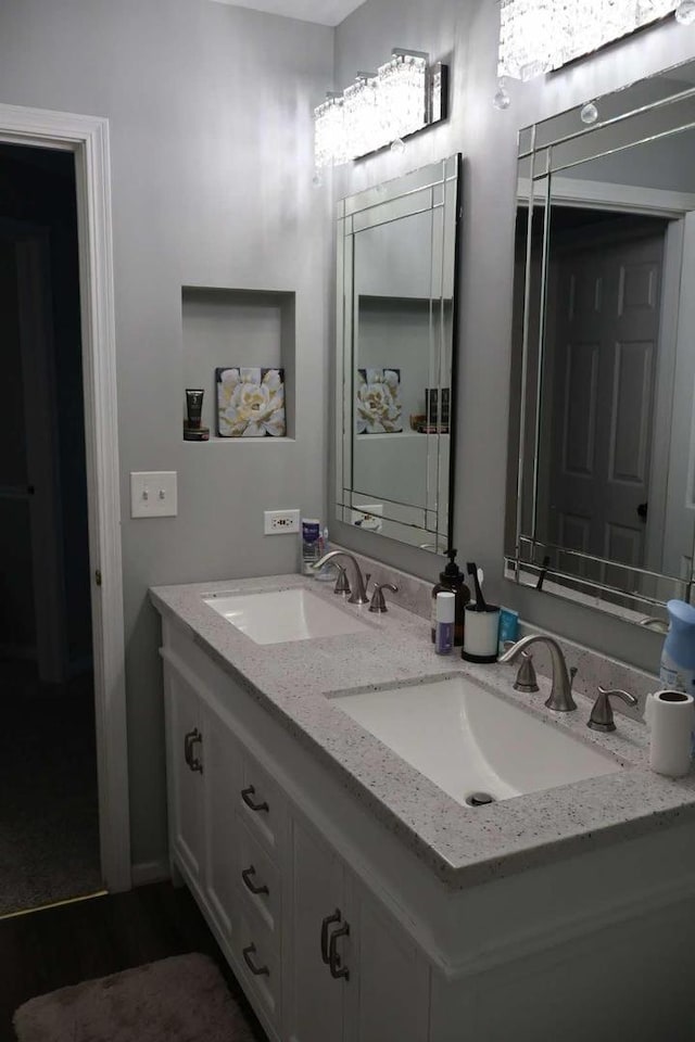 bathroom with double vanity and a sink