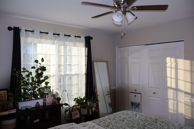 bedroom featuring a ceiling fan and a closet